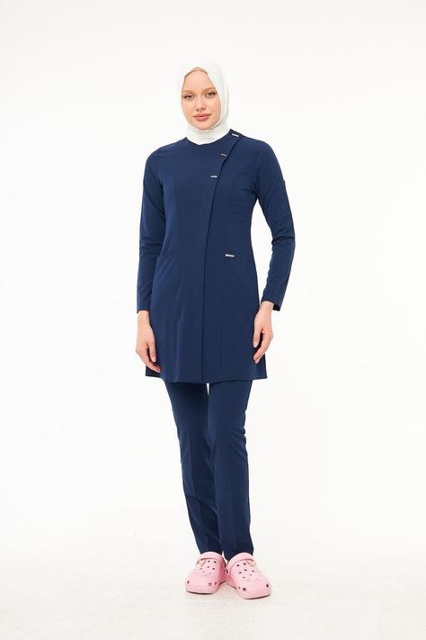 Female healthcare executive in tailored professional lab coat at medical center