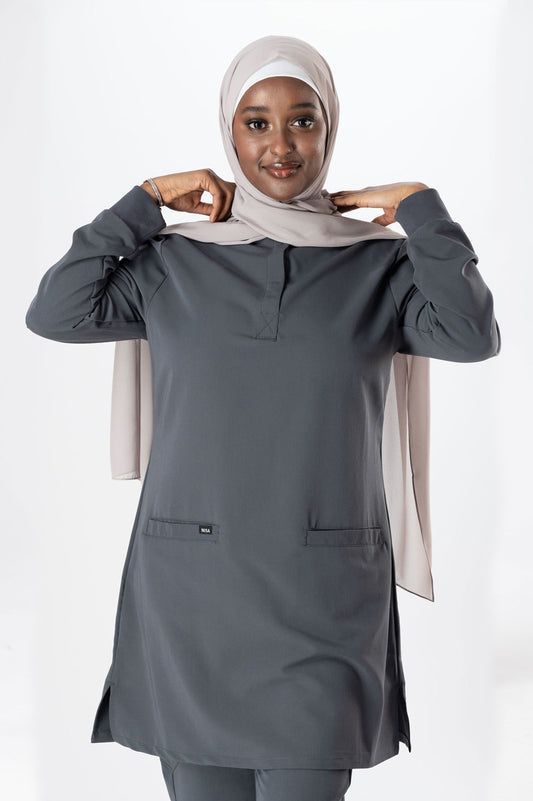 Close-up detail of premium concierge uniform showing quality tailoring and Saudi-inspired accents